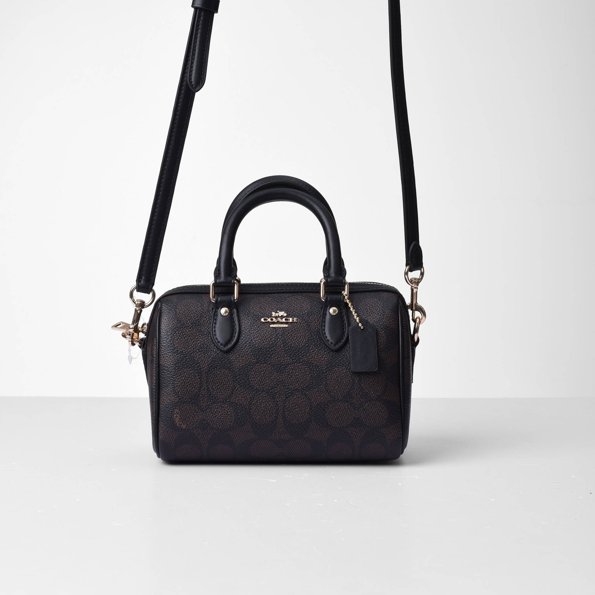 COACH SIGNATURE MINI ROWAN CROSS BAG - DARK BROWN
