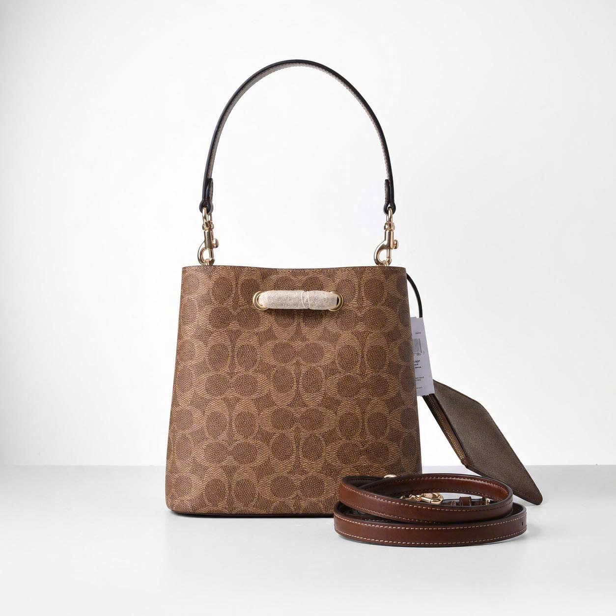 COACH SIGNATURE ROWAN BUCKET BAG - BROWN