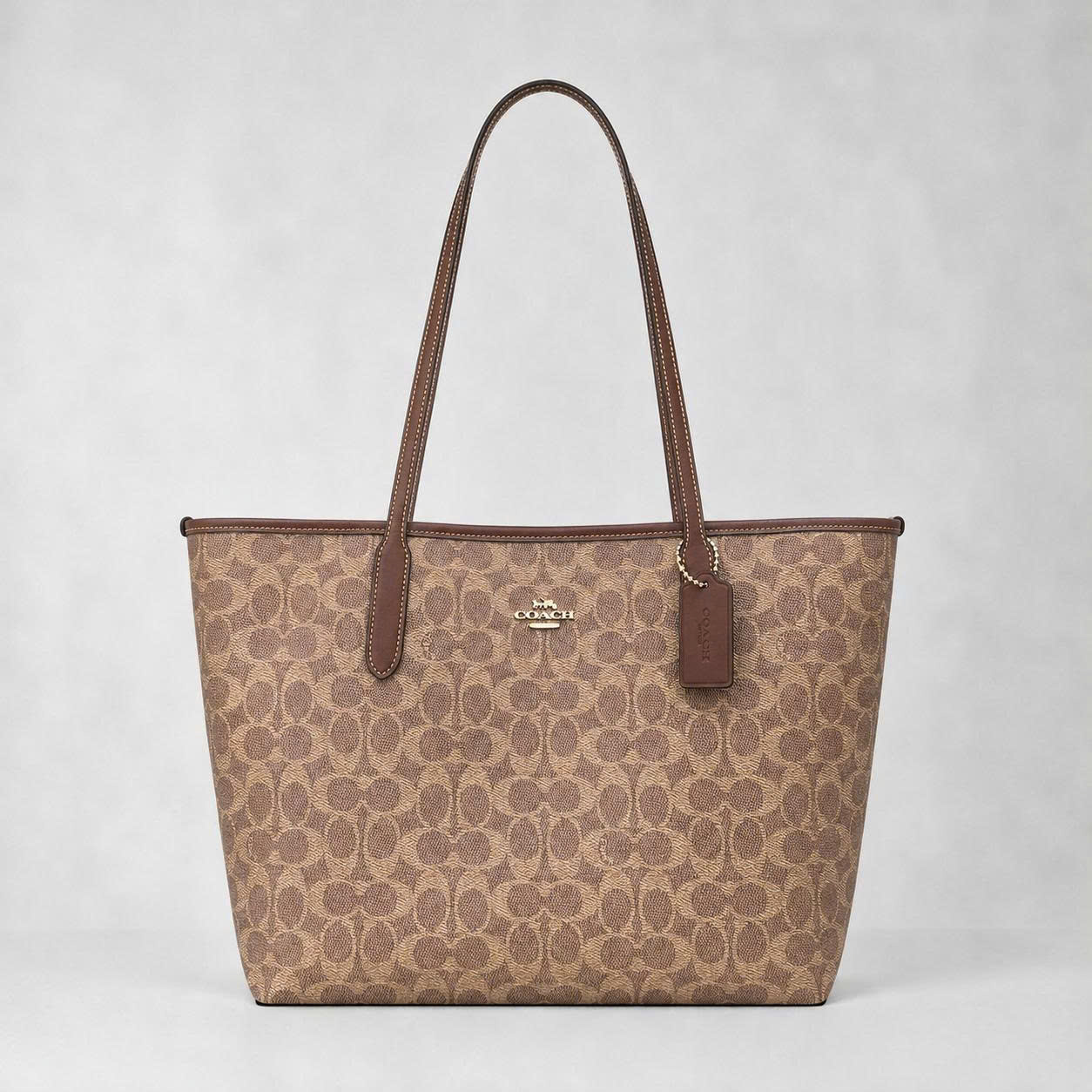 COACH SIGNATURE CV976 CITY TOE BAG - BROWN