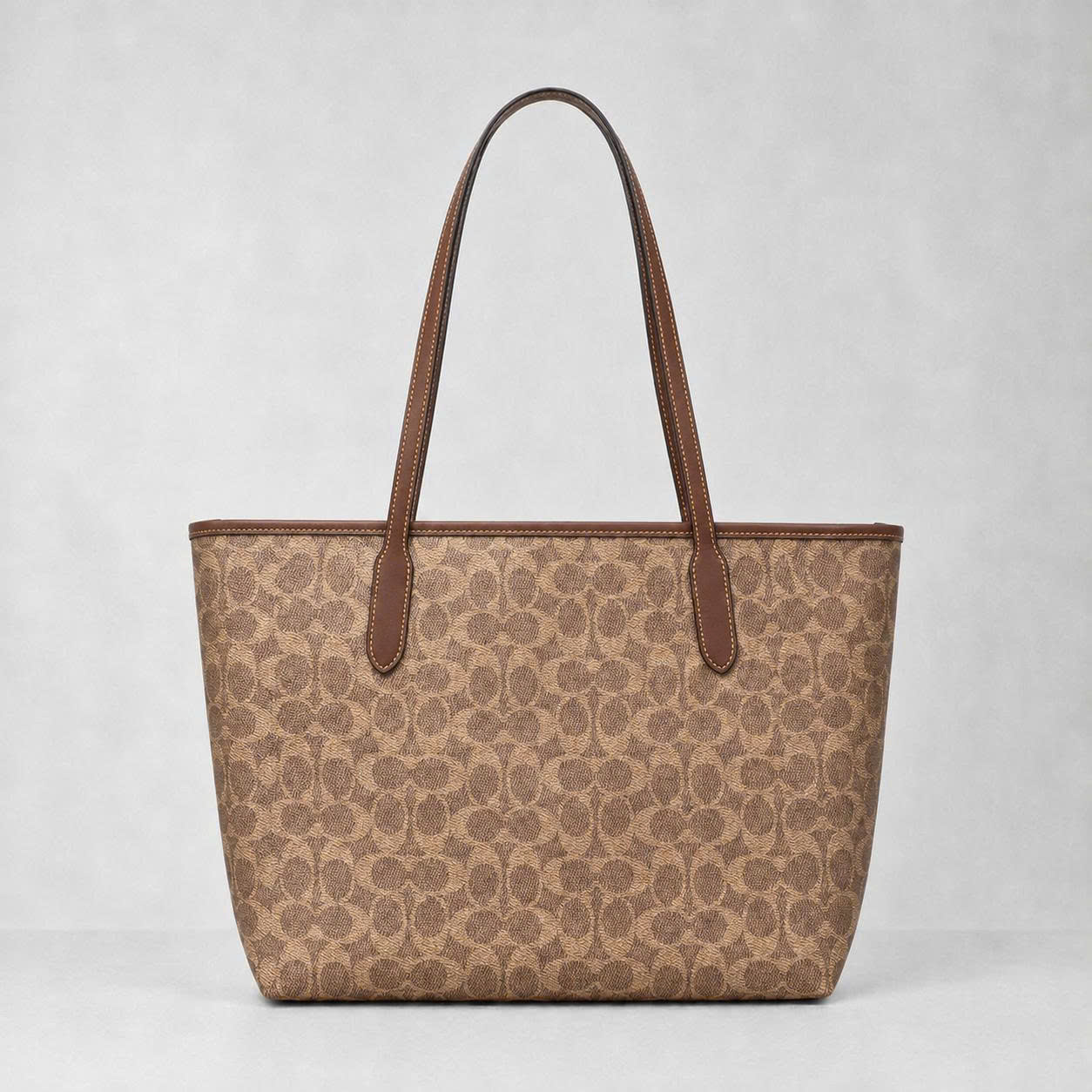 COACH SIGNATURE CV976 CITY TOE BAG - BROWN