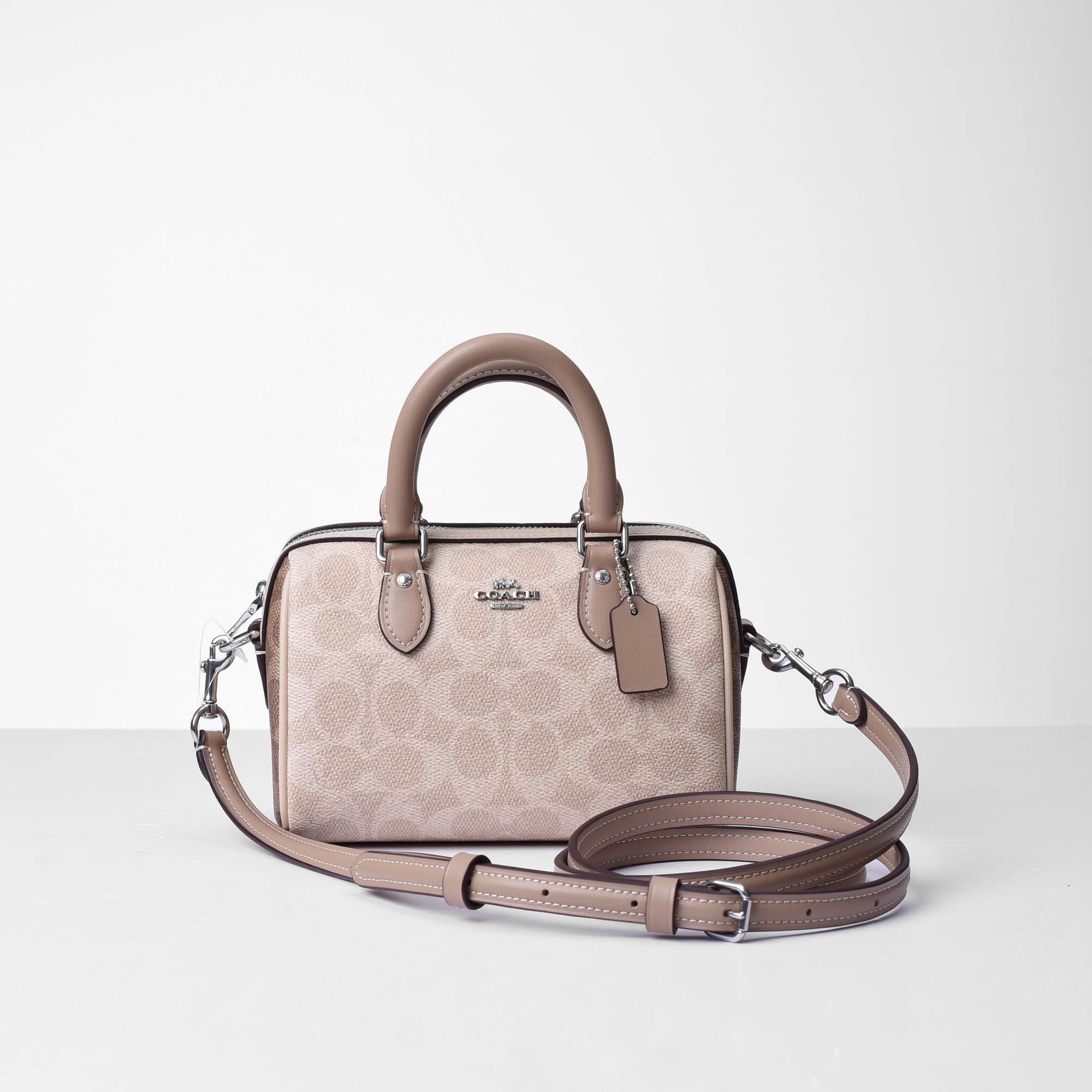 COACH SIGNATURE MINI ROWAN CROSS BAG - SAND